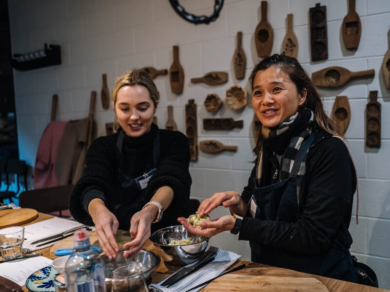 People cooking together in a class